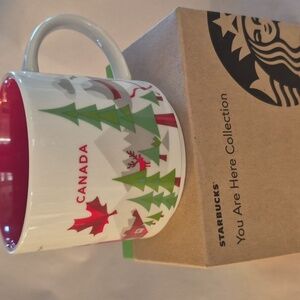 Starbucks Canada Mug with Red Maple Leaf Green Tree Tan Hat Design 2013